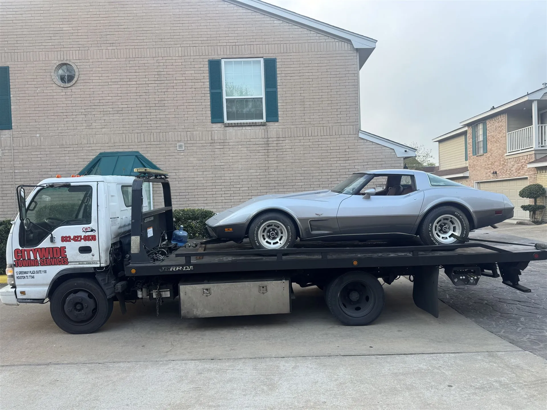 Citywide Towing Services flatbed truck towing a vehicle in Houston, TX