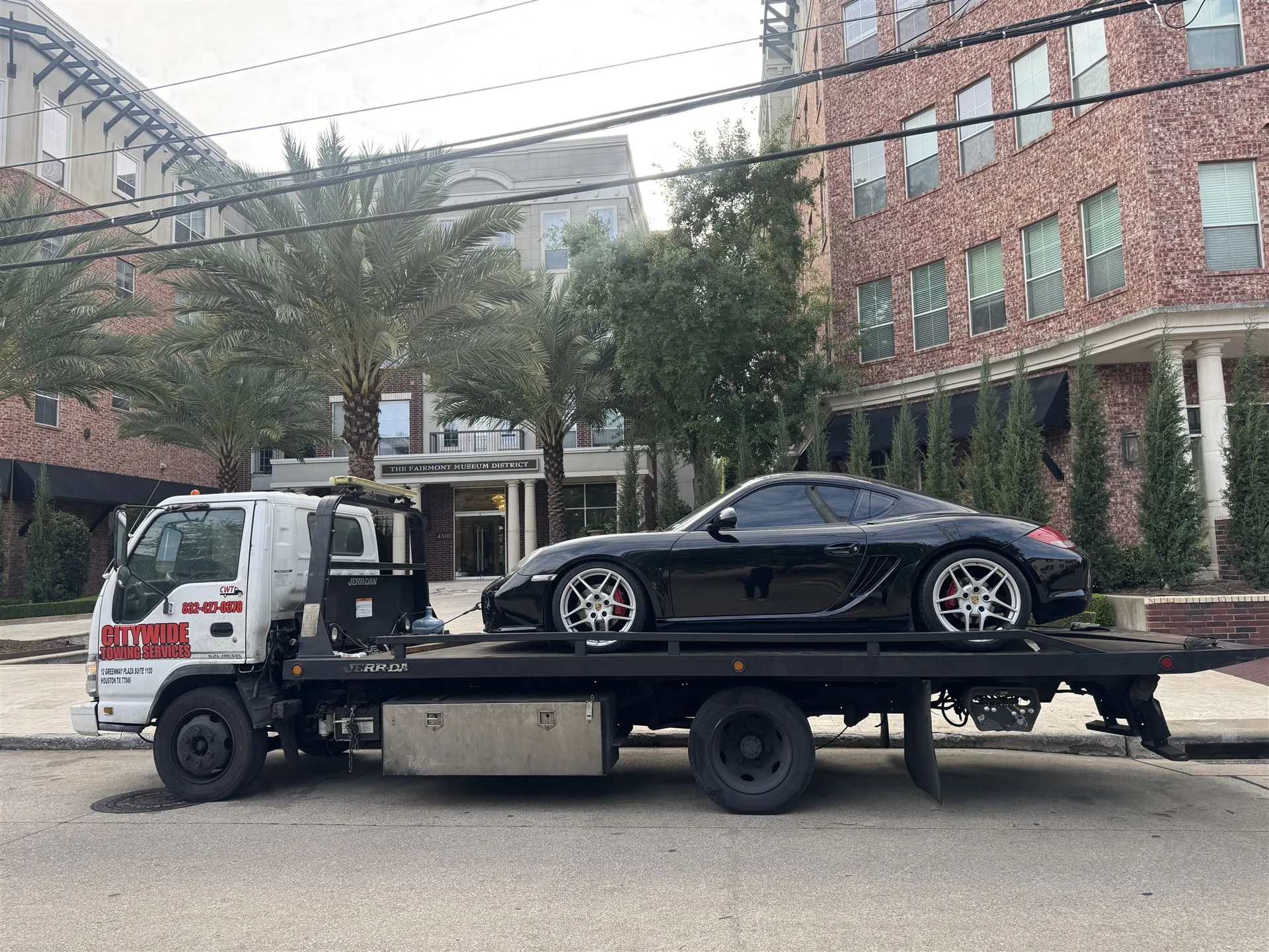 Citywide Towing Services flatbed truck towing a vehicle in Houston, TX