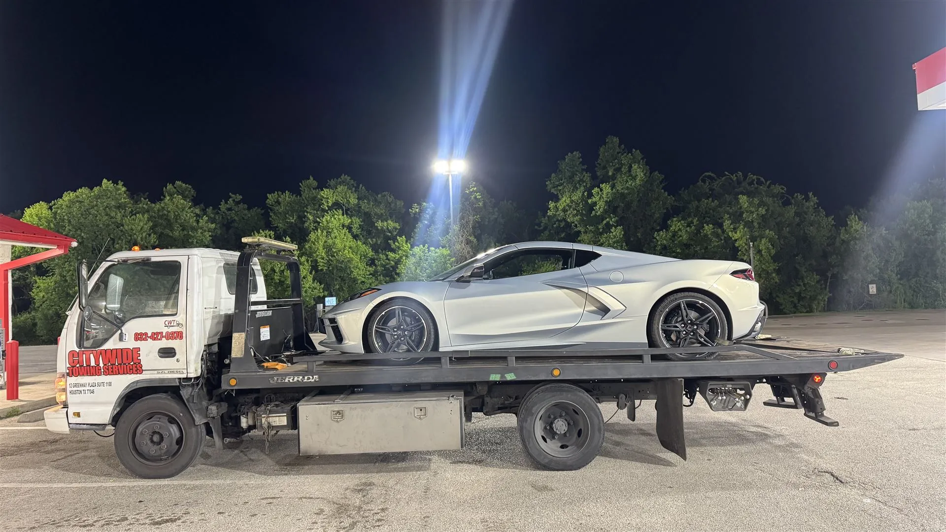 Citywide Towing Services flatbed truck towing a vehicle in Houston, TX