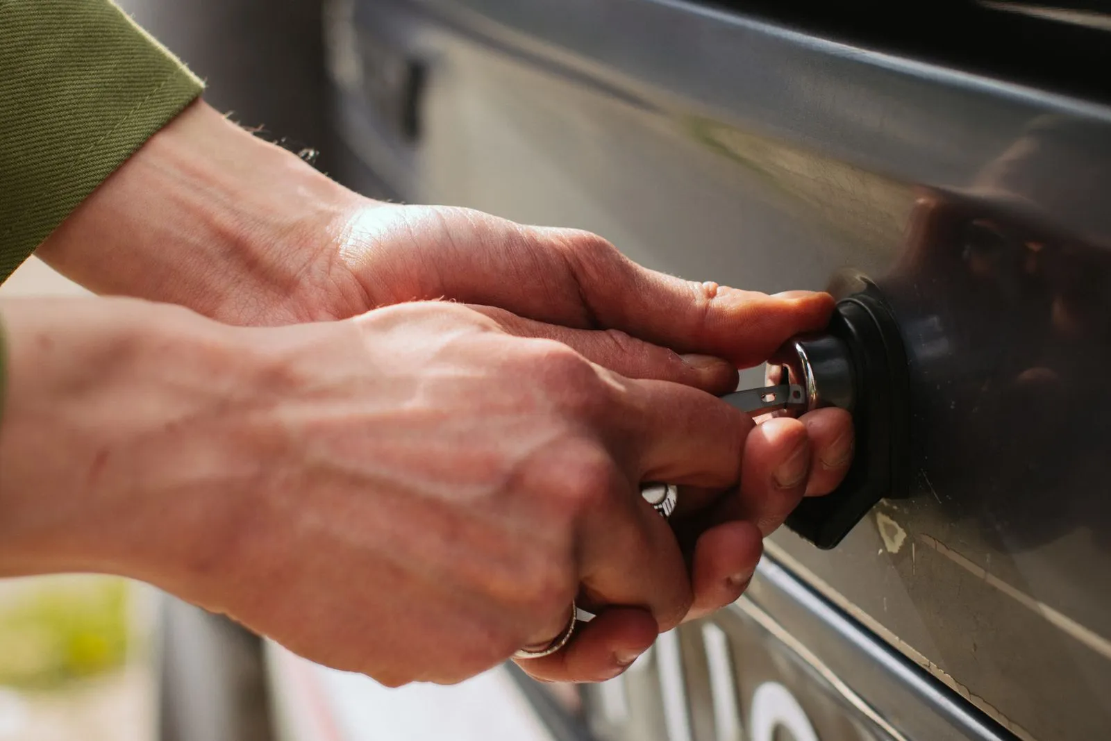 Technician unlocking a car door during a lockout service call