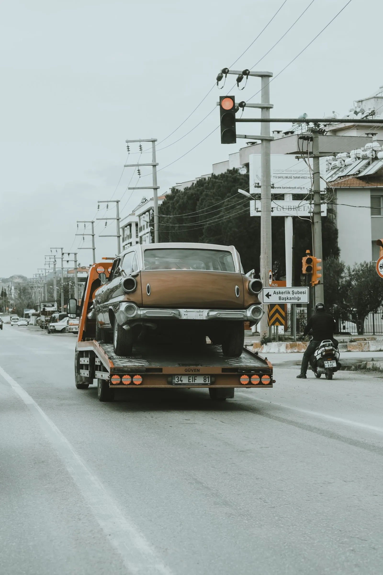 Vehicle secured on a flatbed tow truck