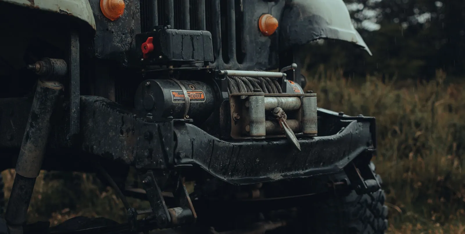 Winch and cable mounted on a recovery truck for off-road towing